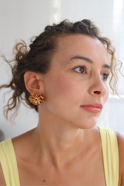 Woman wearing a yellow top with a blurred background